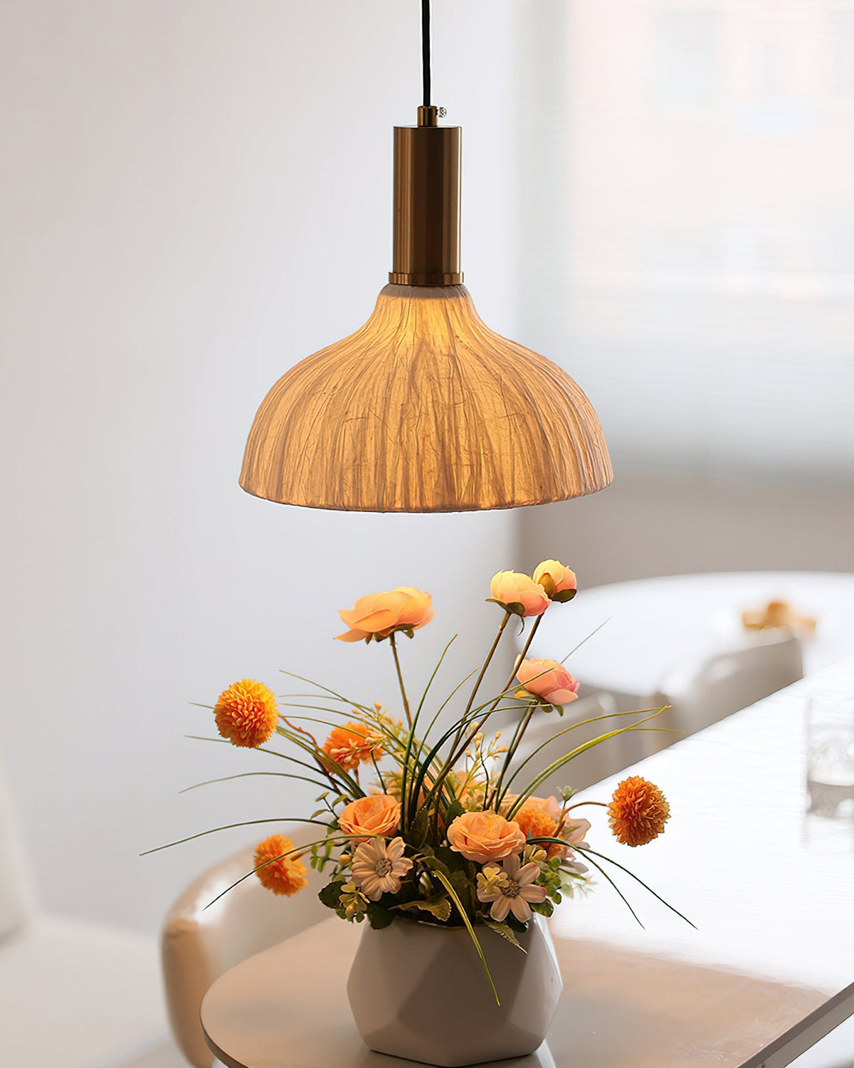 Siya Pendant Light used as a bedside lamp in a modern bedroom.