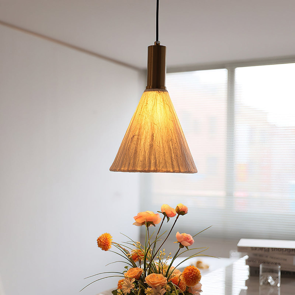 Siya Pendant Light, Model A, hanging in a minimalist living room.