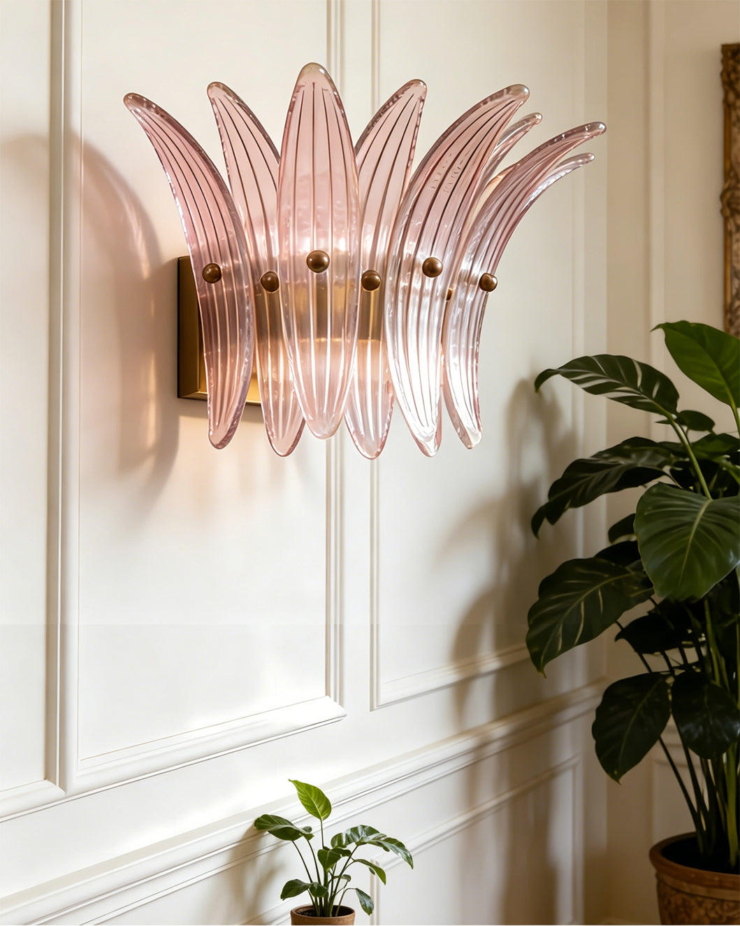 Amber Smeralda Wall Sconce casting a warm, inviting glow.