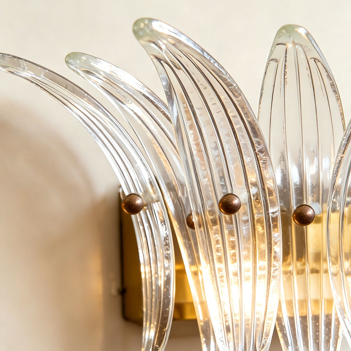 Gold Smeralda Wall Sconce highlighting its luxurious appeal.