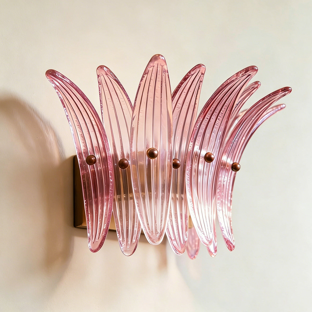 Lifestyle image of two Smeralda Wall Sconces framing a large mirror.