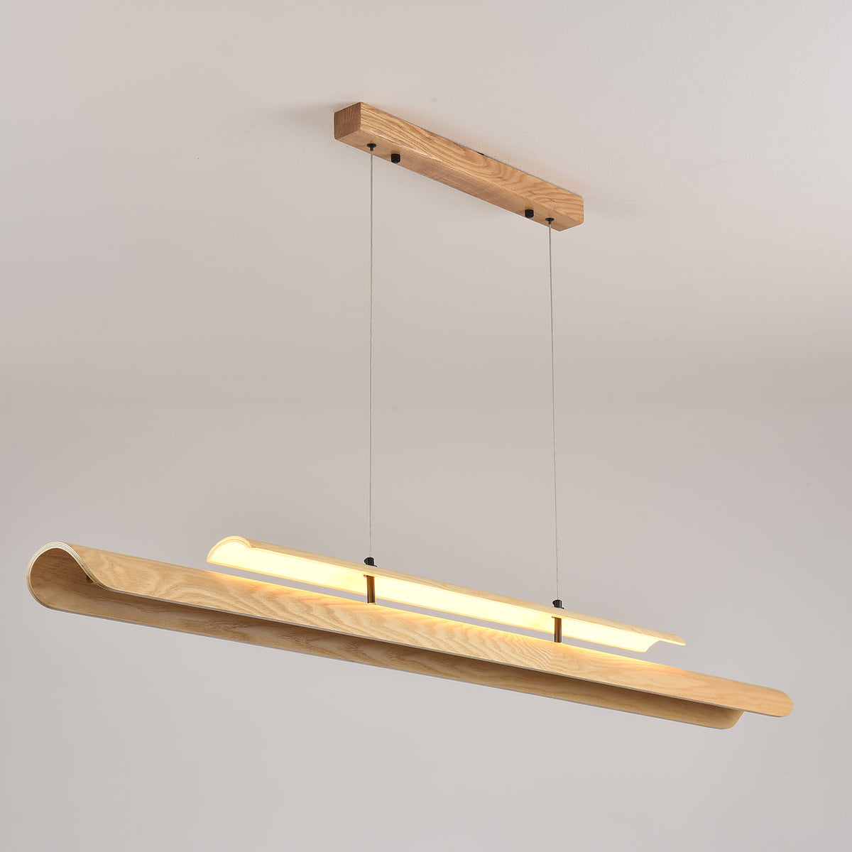 The indirect lighting effect cast on the ceiling by the chandelier.