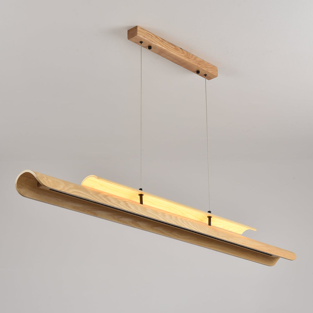 Sora Linear Chandelier shown from the side to highlight its slim profile.