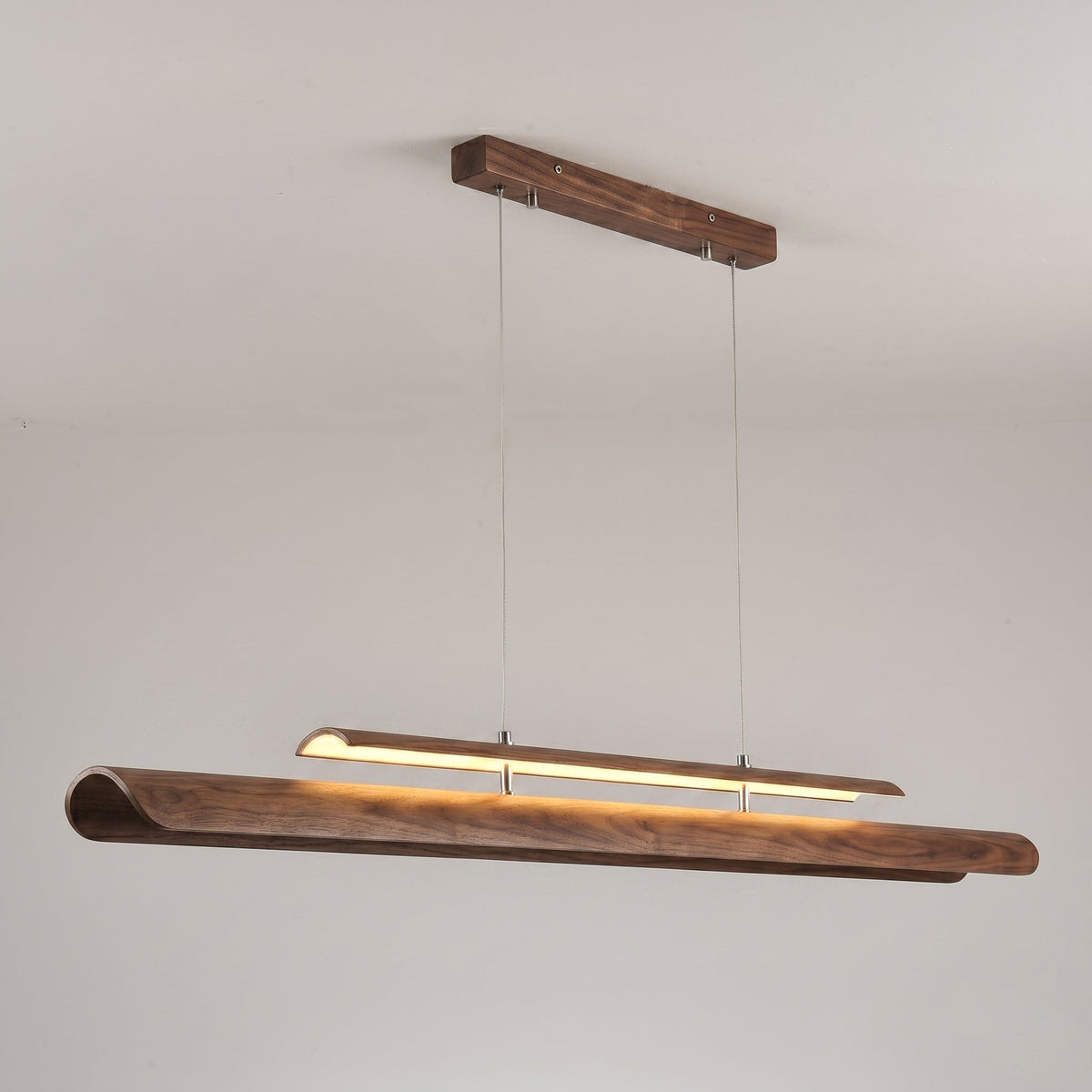Low-angle shot looking up at the Sora Linear Chandelier.