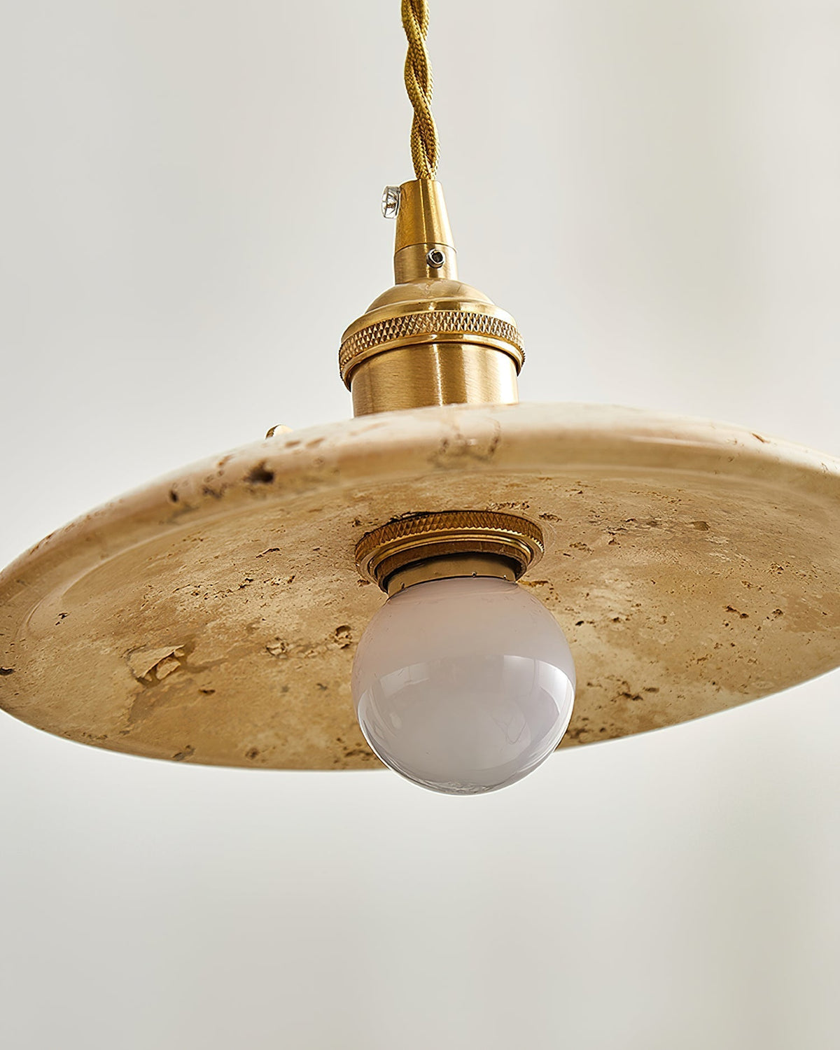 Stella Pendant Light shown turned on, casting a warm and inviting light.