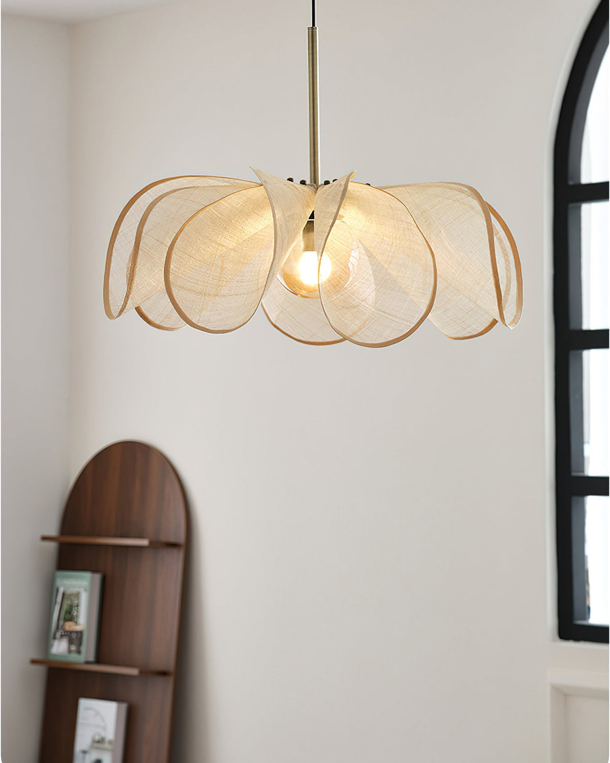The Styria Petals Pendant Lamp hanging in a modern living room setting.