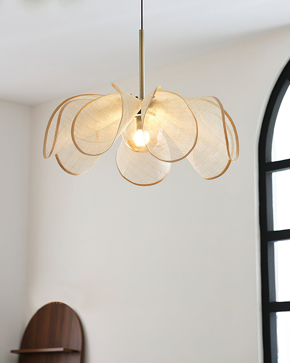A lifestyle image featuring the Styria Petals Pendant Lamp in a cozy reading nook.