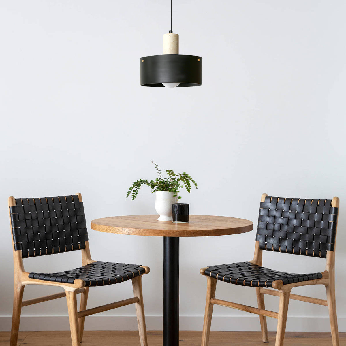 Close-up on the smooth, natural travertine accent of the pendant lamp.