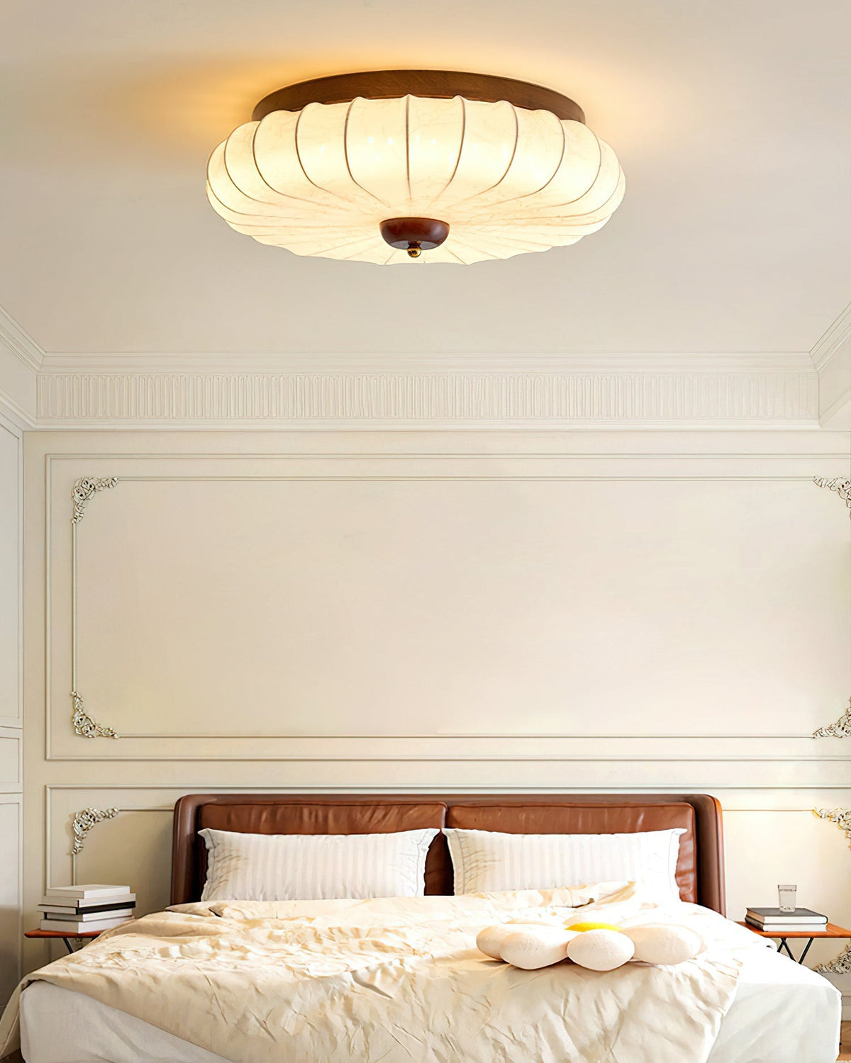 The light fixture against a white ceiling.