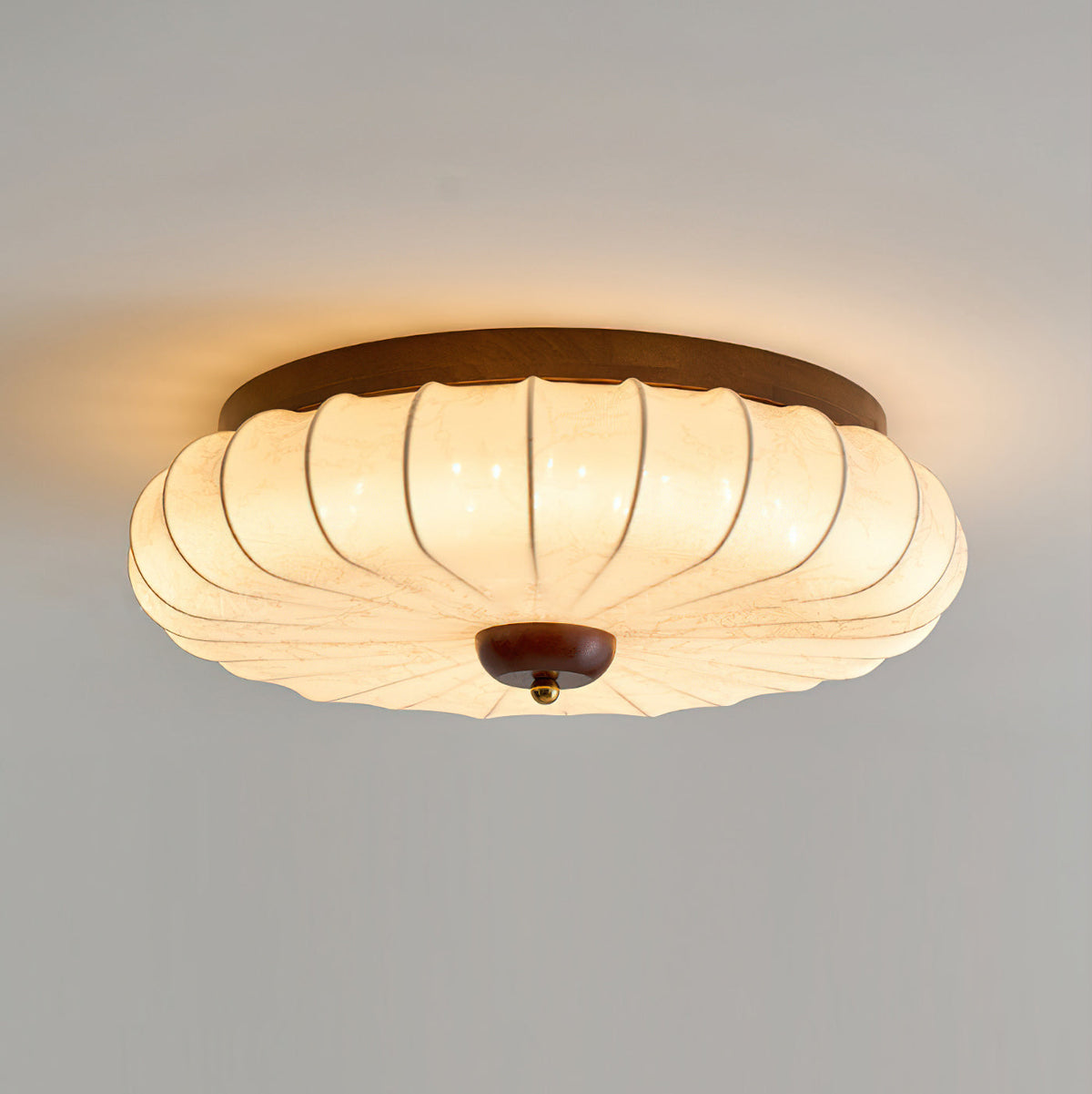 Angled view of the Tate Walnut Flush Mount.