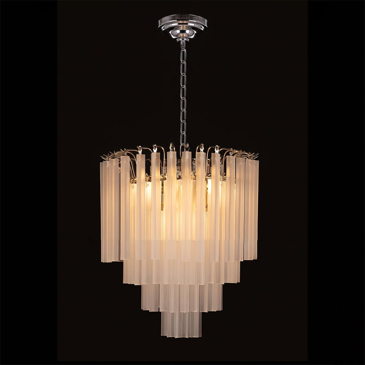 Triedra Cascade Chandelier illuminated at night.