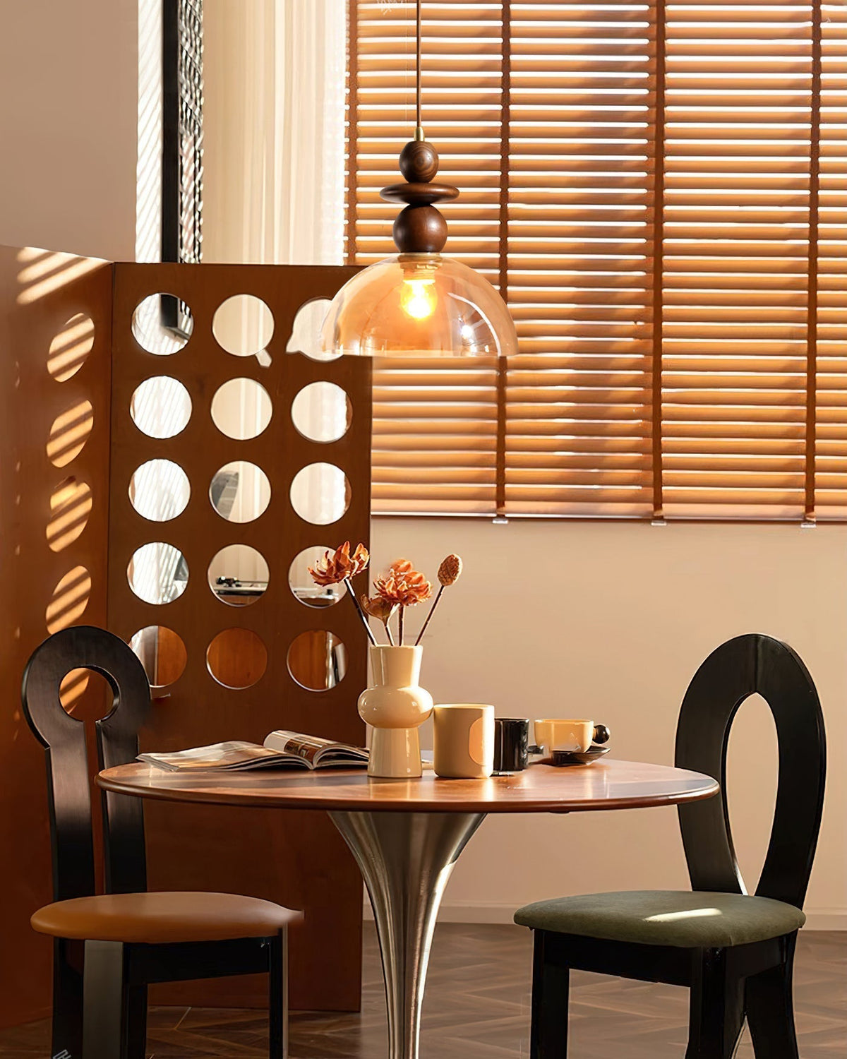 Valeska Pendant Light shown in a modern dining room setting.