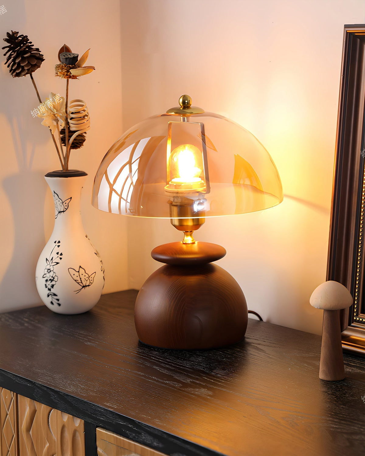 The Valeska Table Lamp illuminating a living room corner.