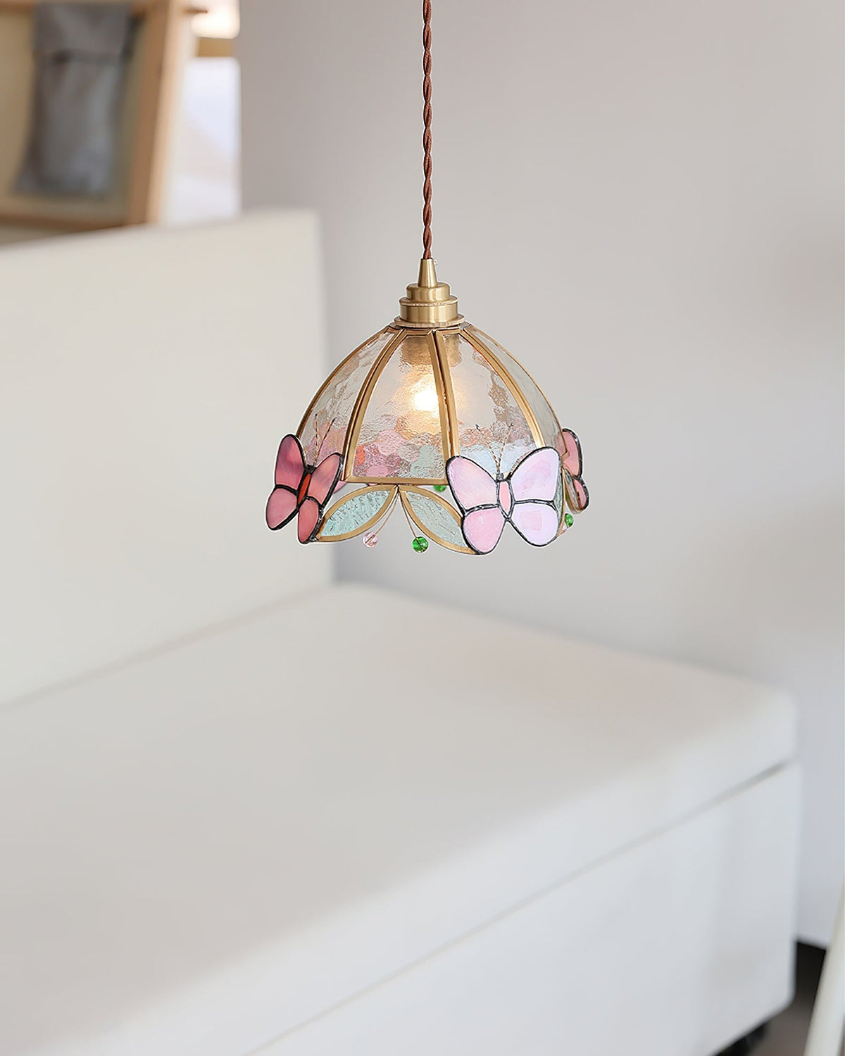Lifestyle image of the Valinte pendant light in a child's bedroom.
