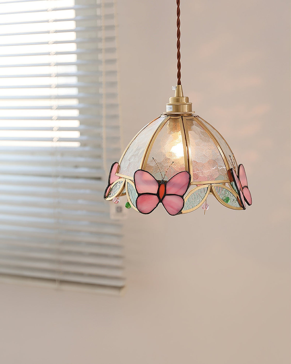 Detailed shot of the stained-glass panels on the Valinte pendant light.