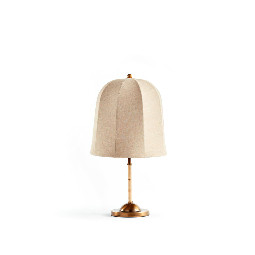 Vanna Table Lamp with gold base and beige linen shade on a neutral background.