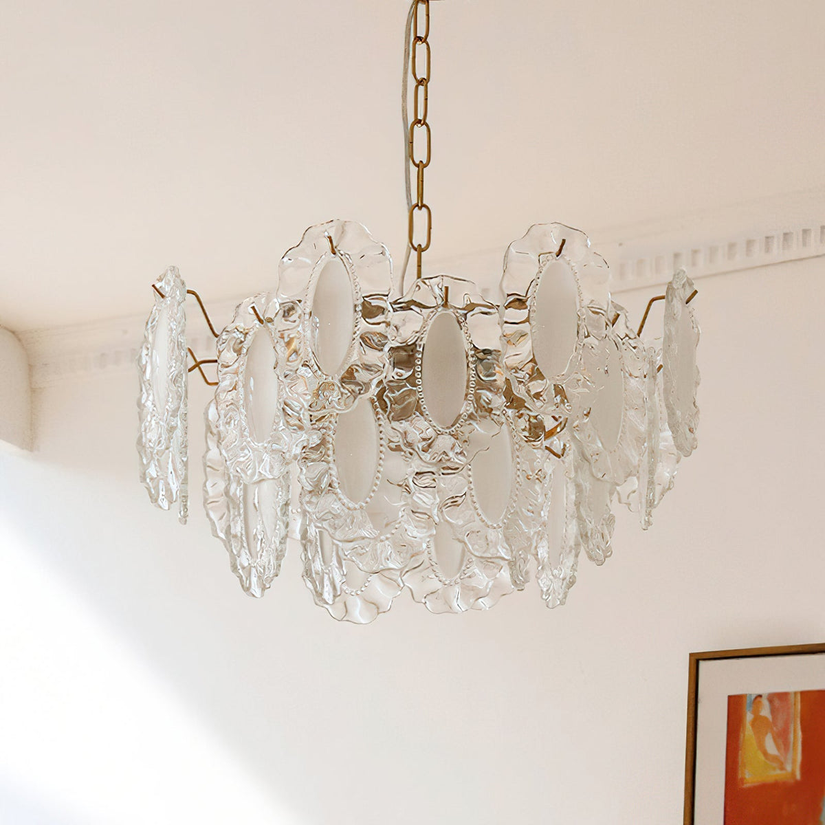 Varvara Glass Chandelier shown in a dining room above a table.