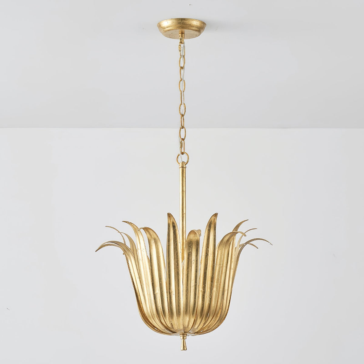 Vicenzio Leaf Pendant Light illuminated, casting a warm glow.
