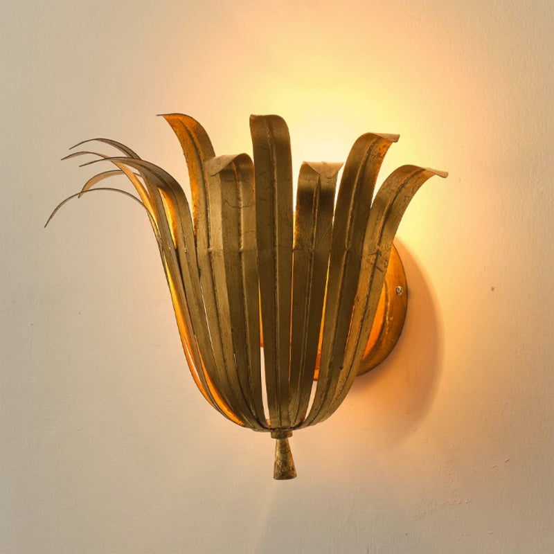 Unlit Vicenzio Leaf Wall Lamp in white against a light wall.