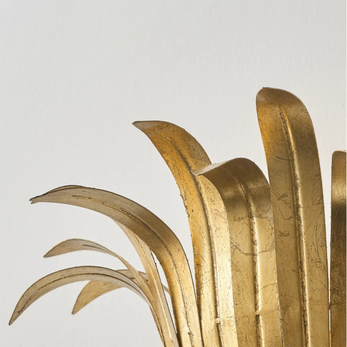 Lifestyle image of the gold leaf lamp in an entryway.
