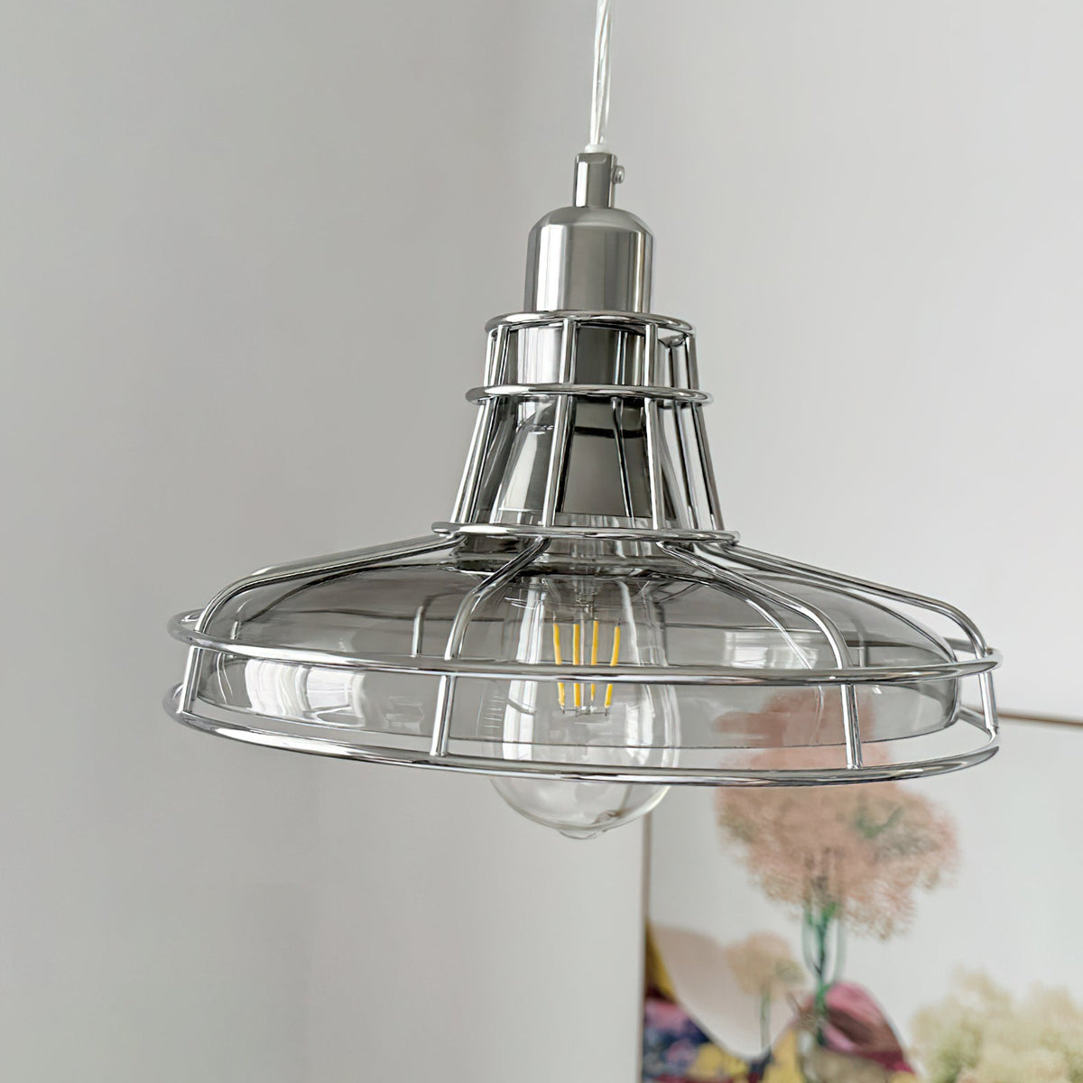 Detail of the chrome fixture and bulb holder on the Williston Pendant Light.