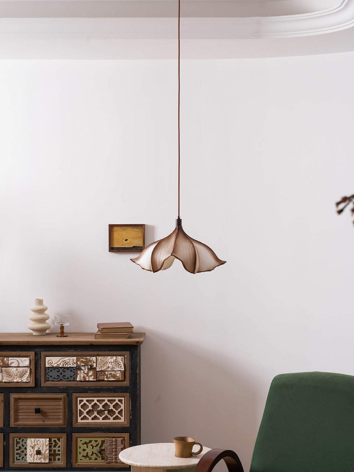The pendant light shown in a commercial space like a cafe.