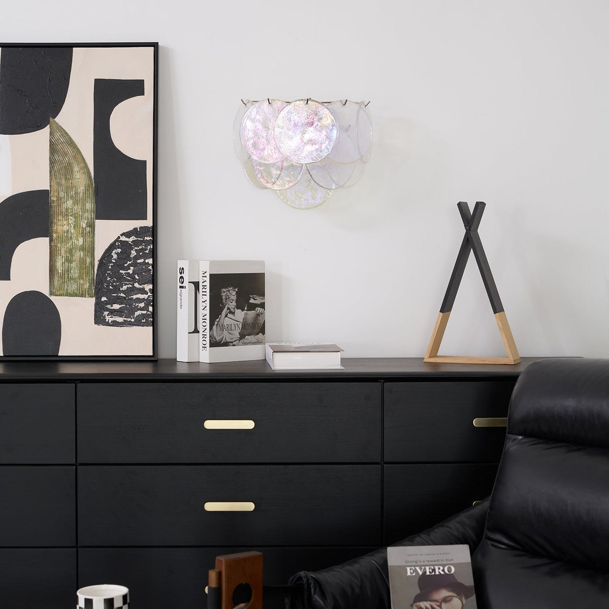 Vistosi Disc Wall Lamp illuminated, casting a warm glow.