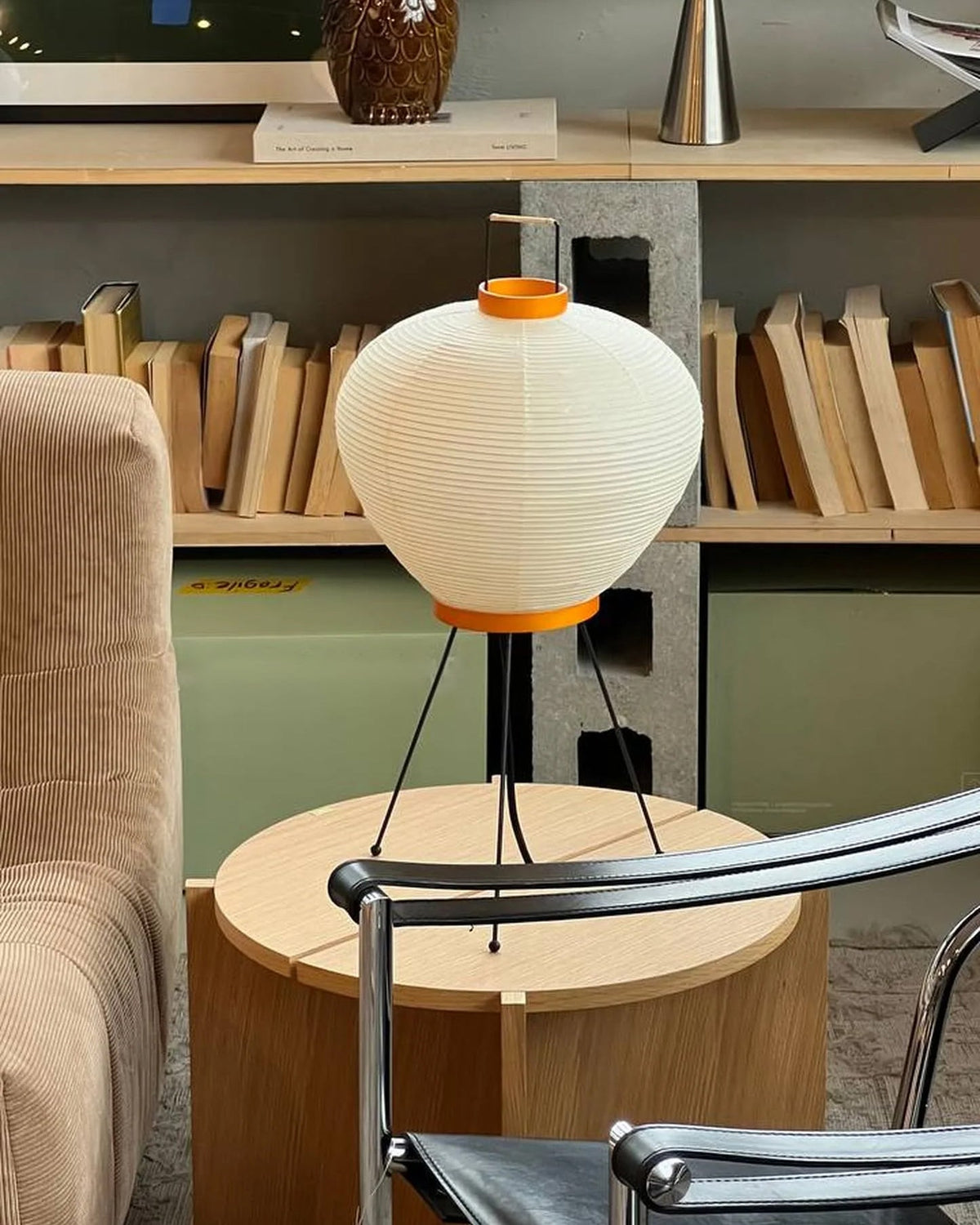 Side profile of the Washi 3A Table Lamp highlighting its minimalist tripod legs.