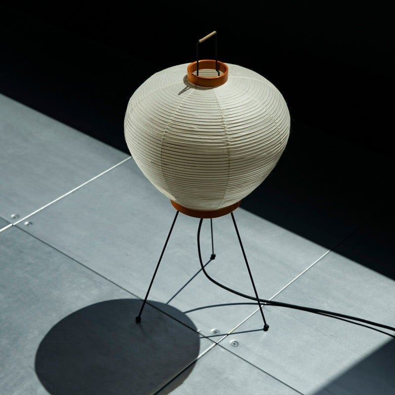 The Washi 3A Table Lamp in a bedroom setting on a nightstand.