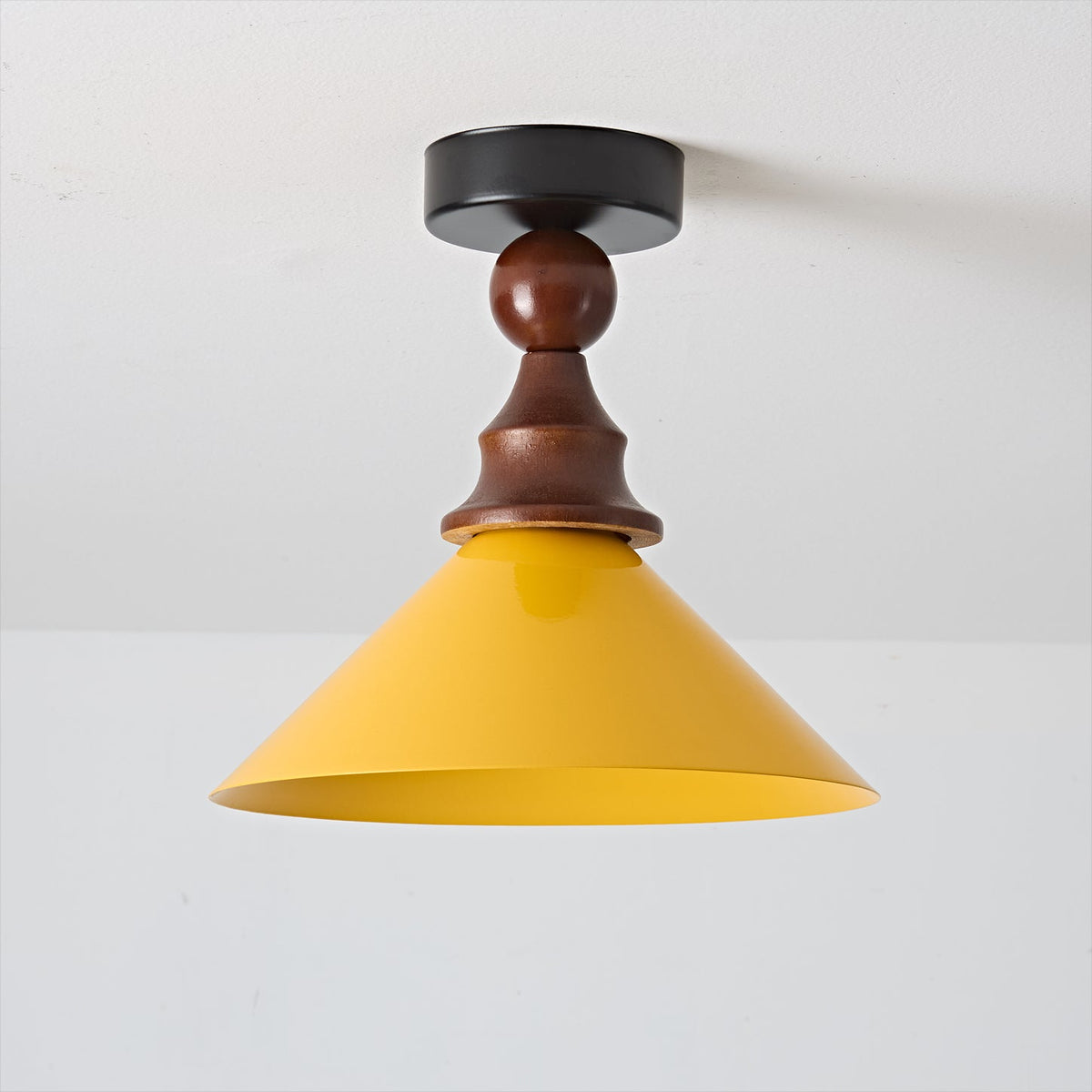 Close-up of the Wilken Ceiling Lamp's wood and metal construction.
