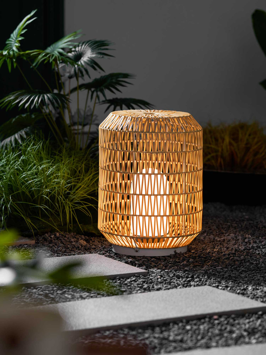 Woven rattan outdoor lamp in a different size option.