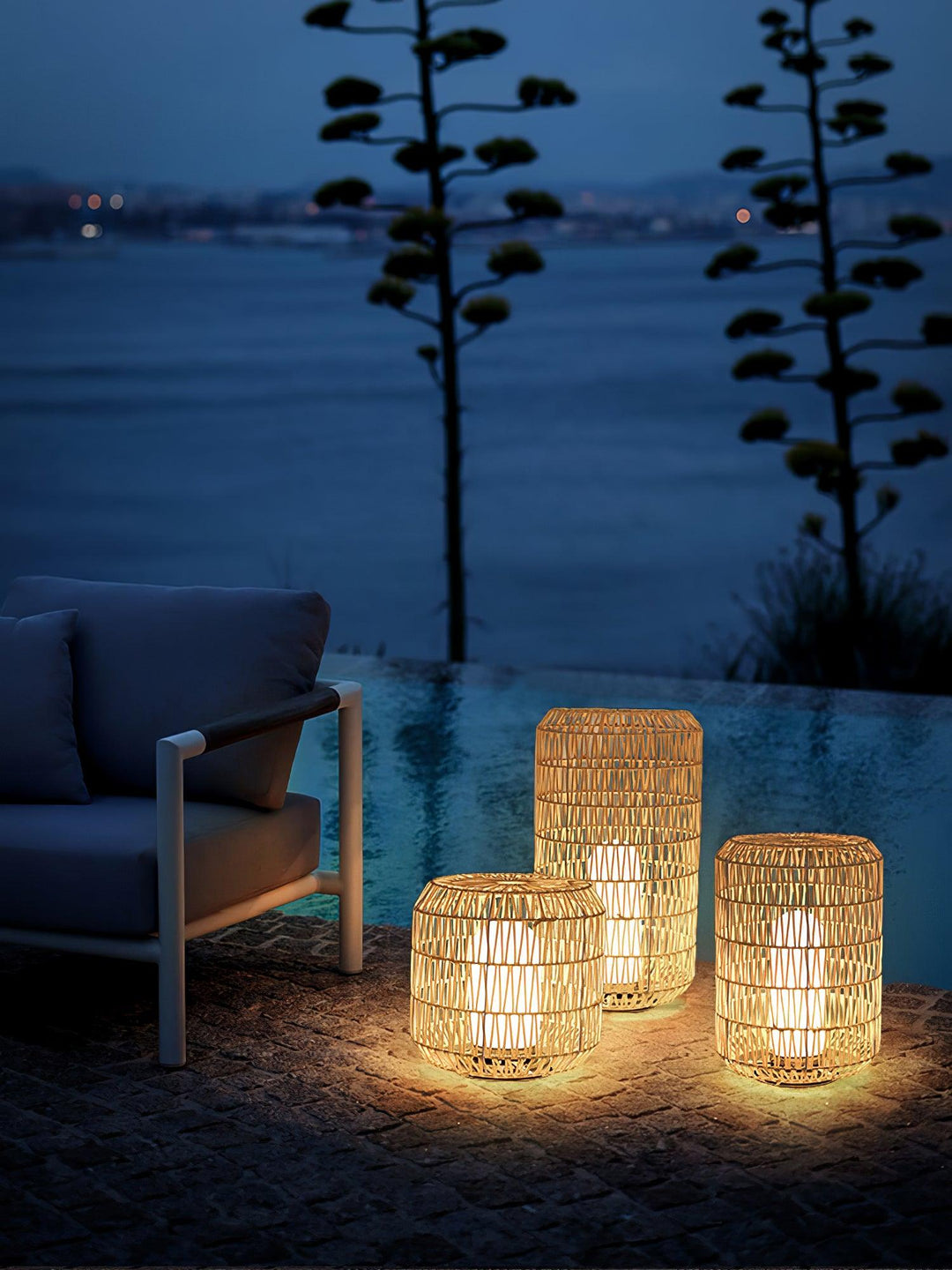 Woven rattan outdoor lamp with a natural finish.