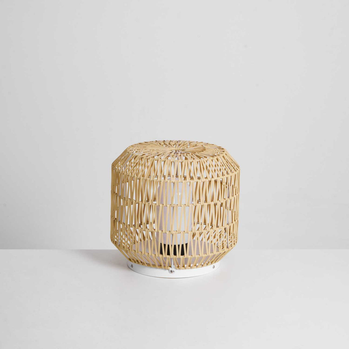Side view of the woven rattan outdoor lamp.
