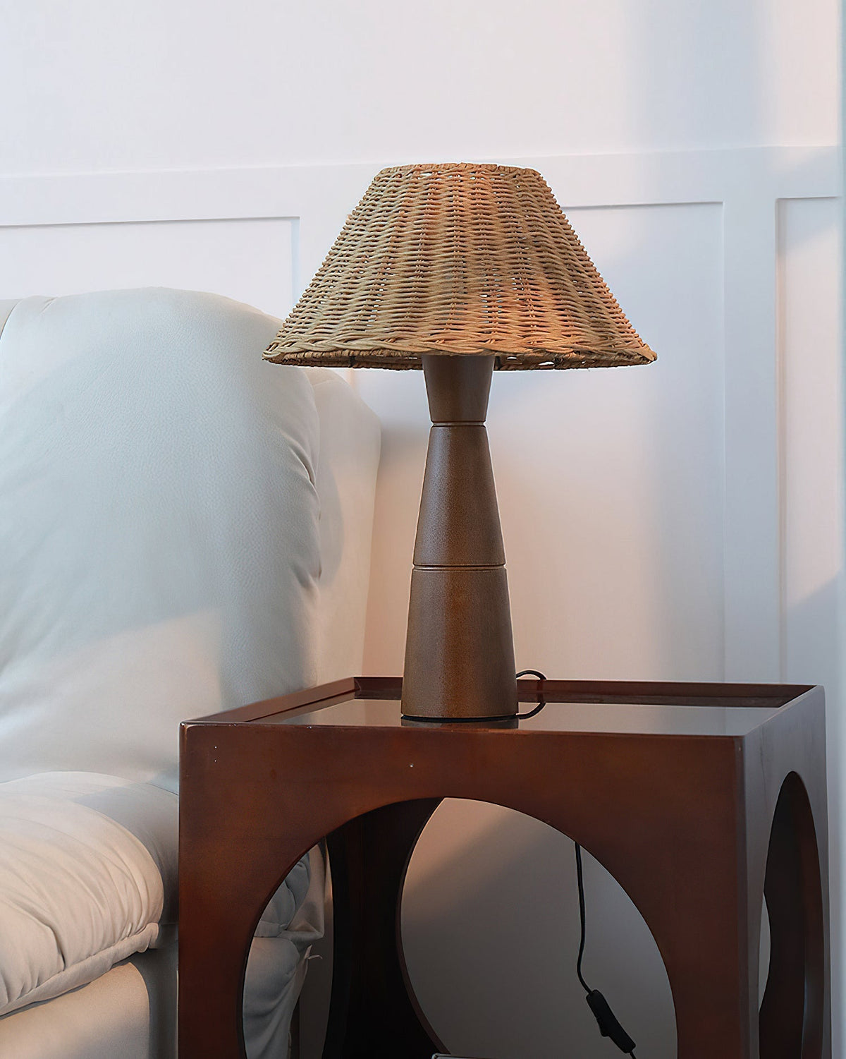 Zaya Table Lamp providing ambient light in a dimly lit room.