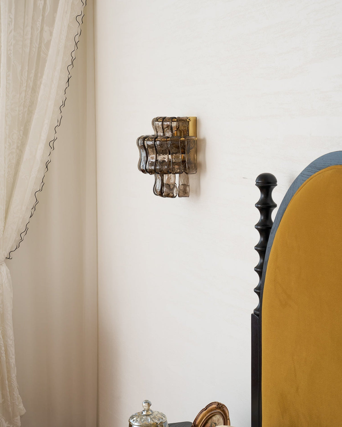 Albano Wall Lamp in black glass in a contemporary entryway.