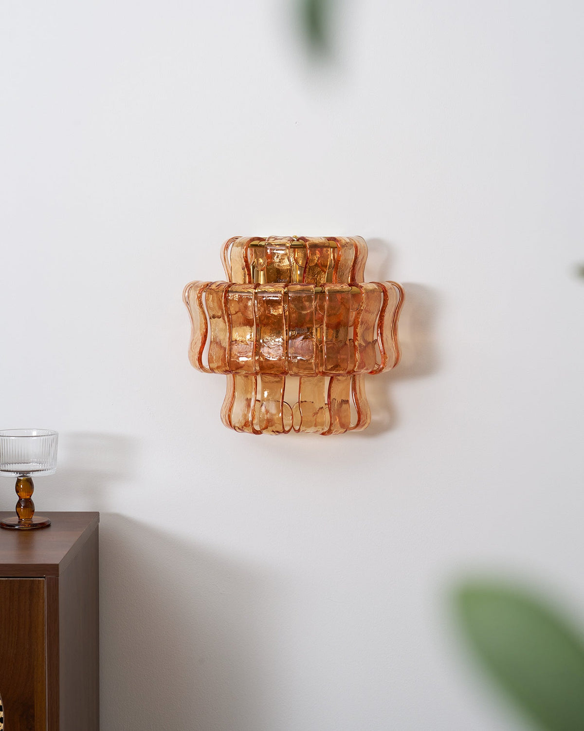 Albano Wall Lamp in amber glass, front view.