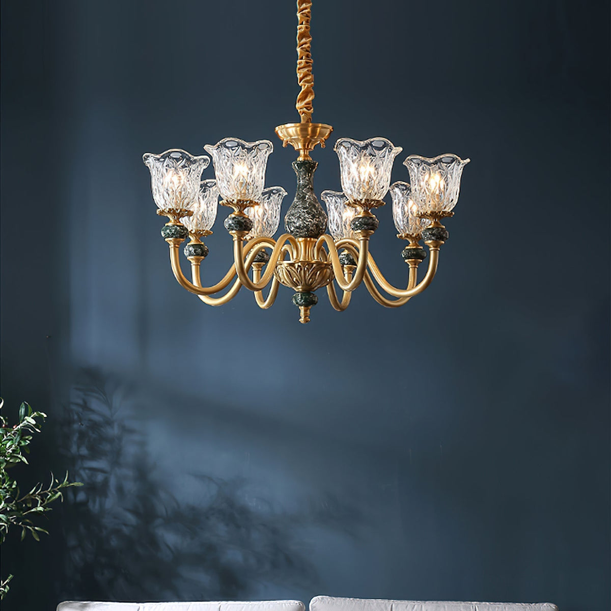 Close-up view of the Dieppe Chandelier's marble and brass details.