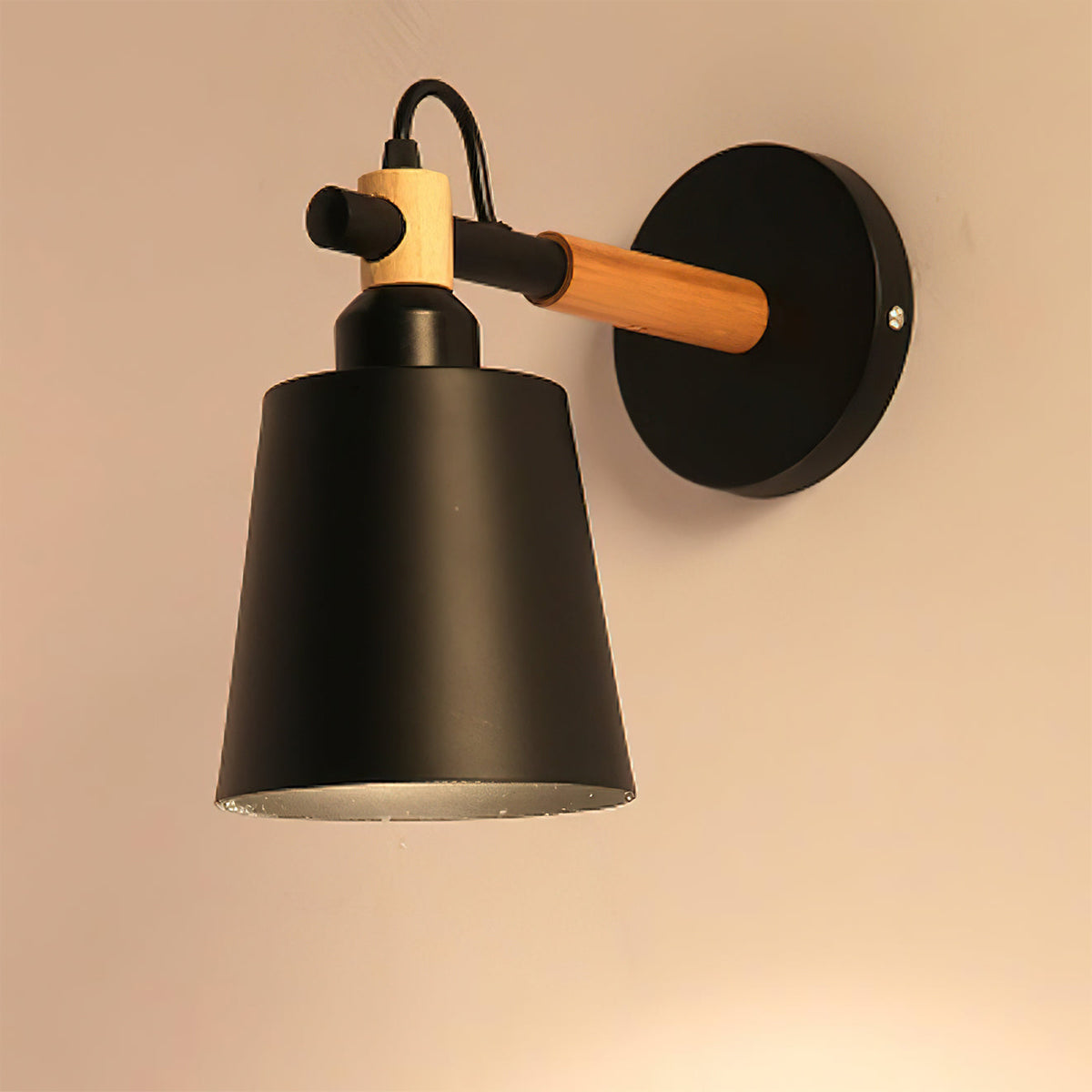 Copita Wall Lamp in wood color finish, highlighting the natural grain.