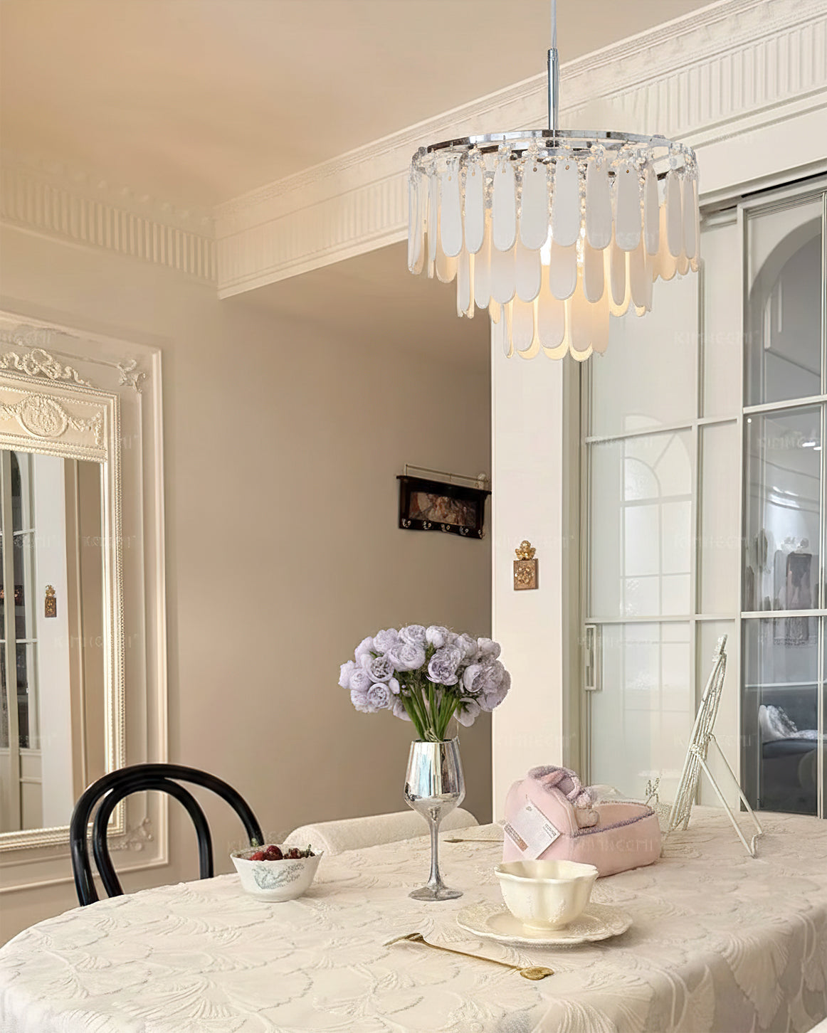 Side profile of the white and chrome ceramic pendant light.