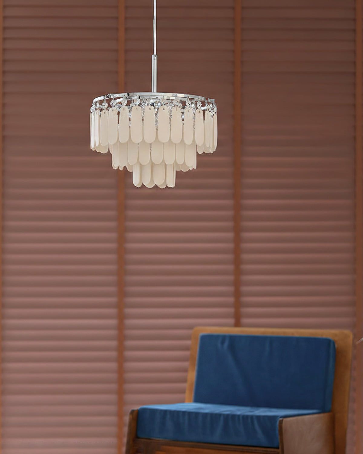 Pendant light shown in a dining room setting over a table.