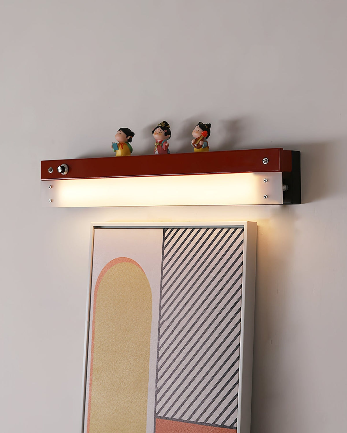 The warm glow from the integrated LED of the Totem Wall Lamp.