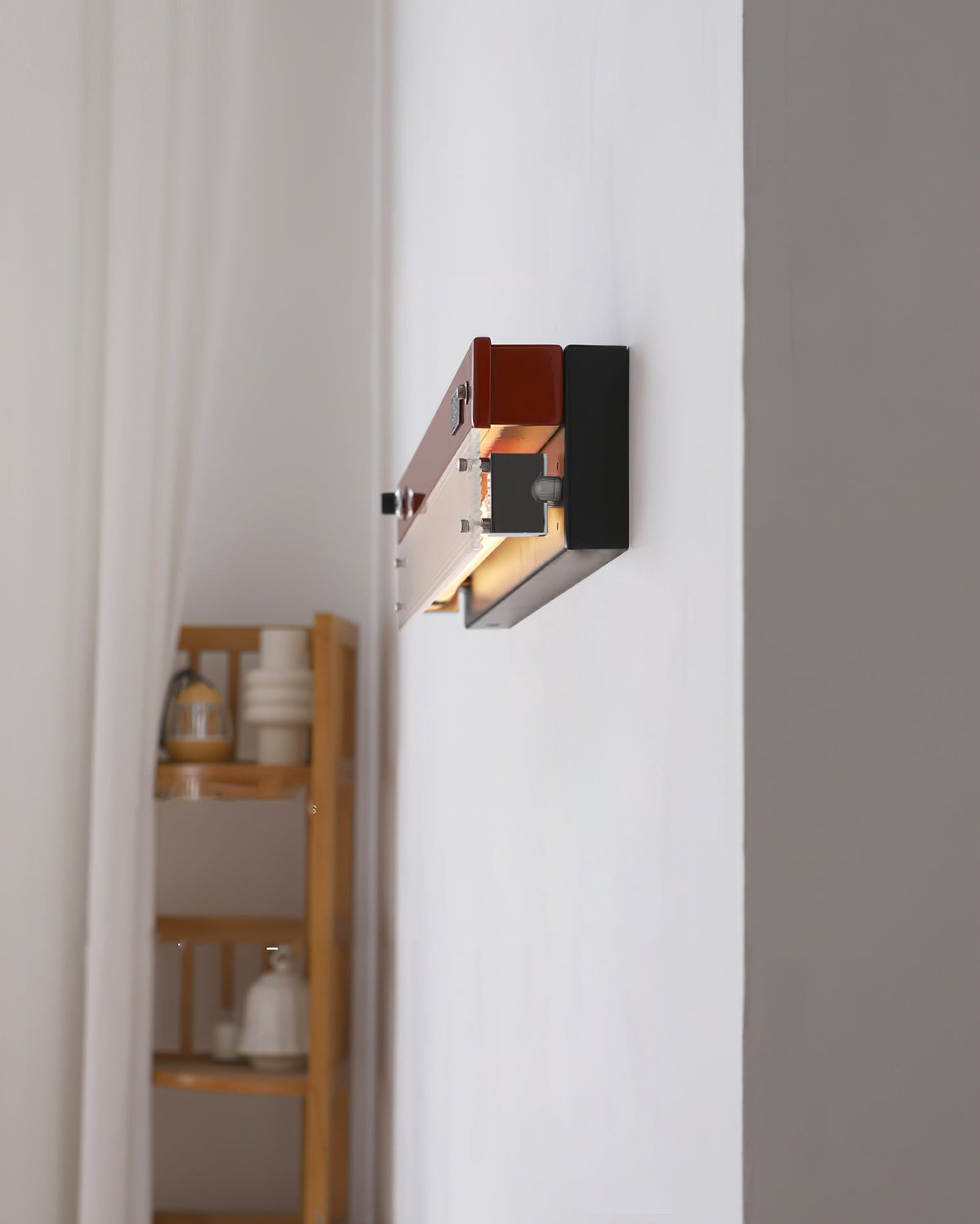 Lifestyle image showing the Totem Wall Lamp in a creative office space.