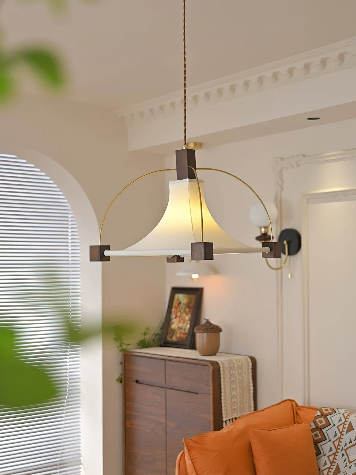 Hood Pendant Light illuminating a dining table