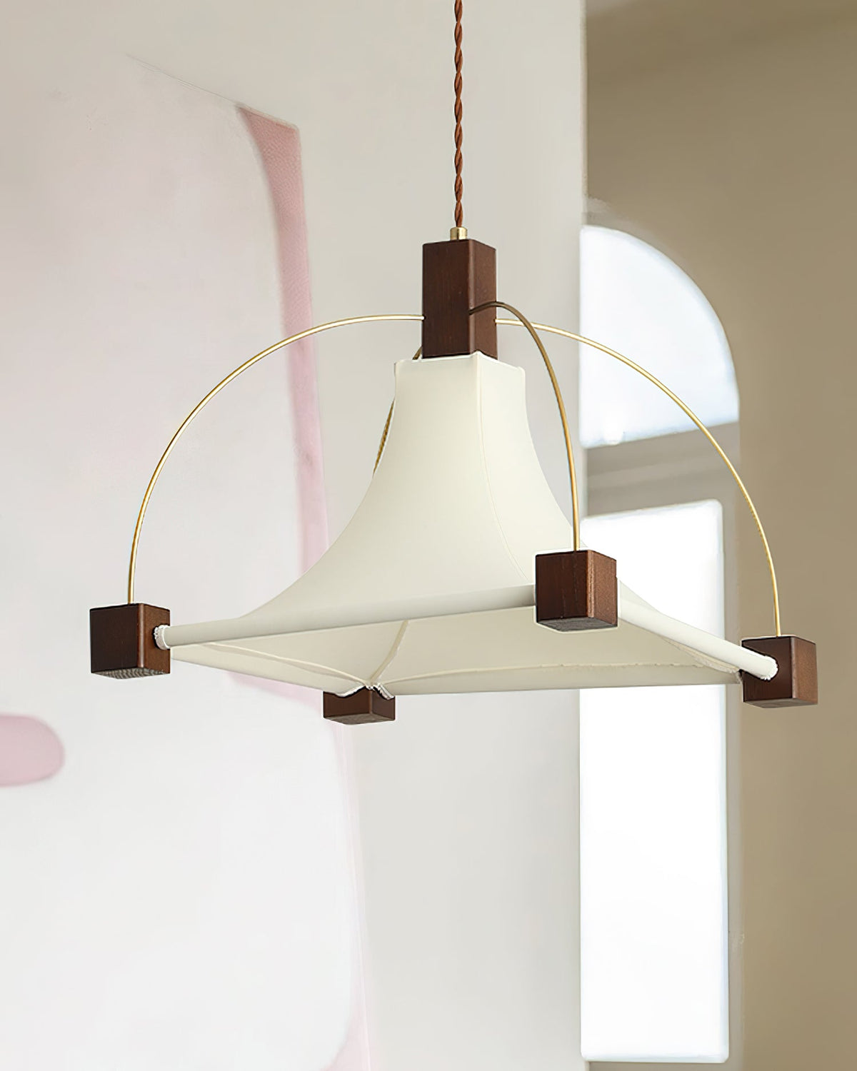 Side view of the Hood Pendant Light showcasing its sculptural arcs