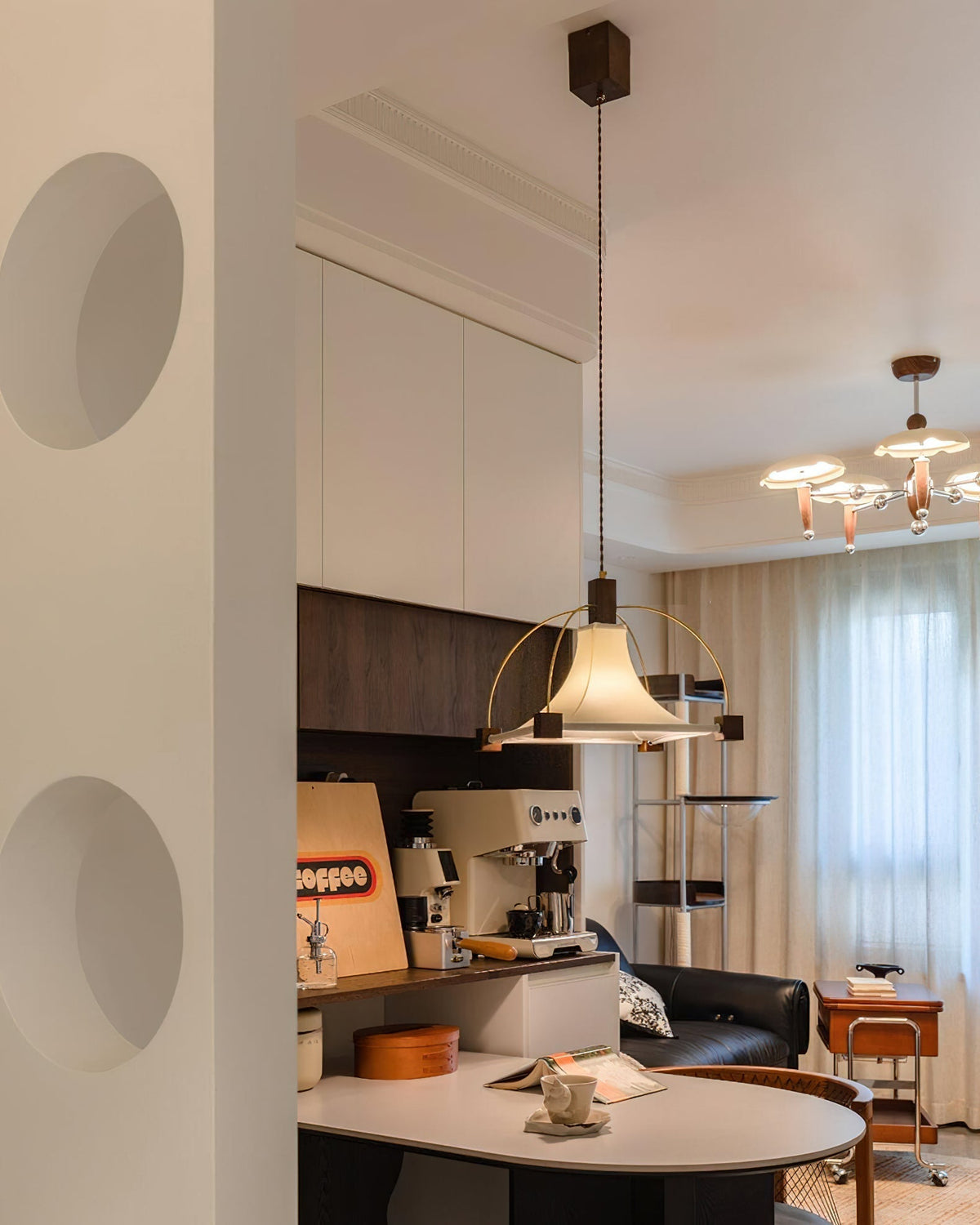 The pendant light shown with the light turned off in a bright room