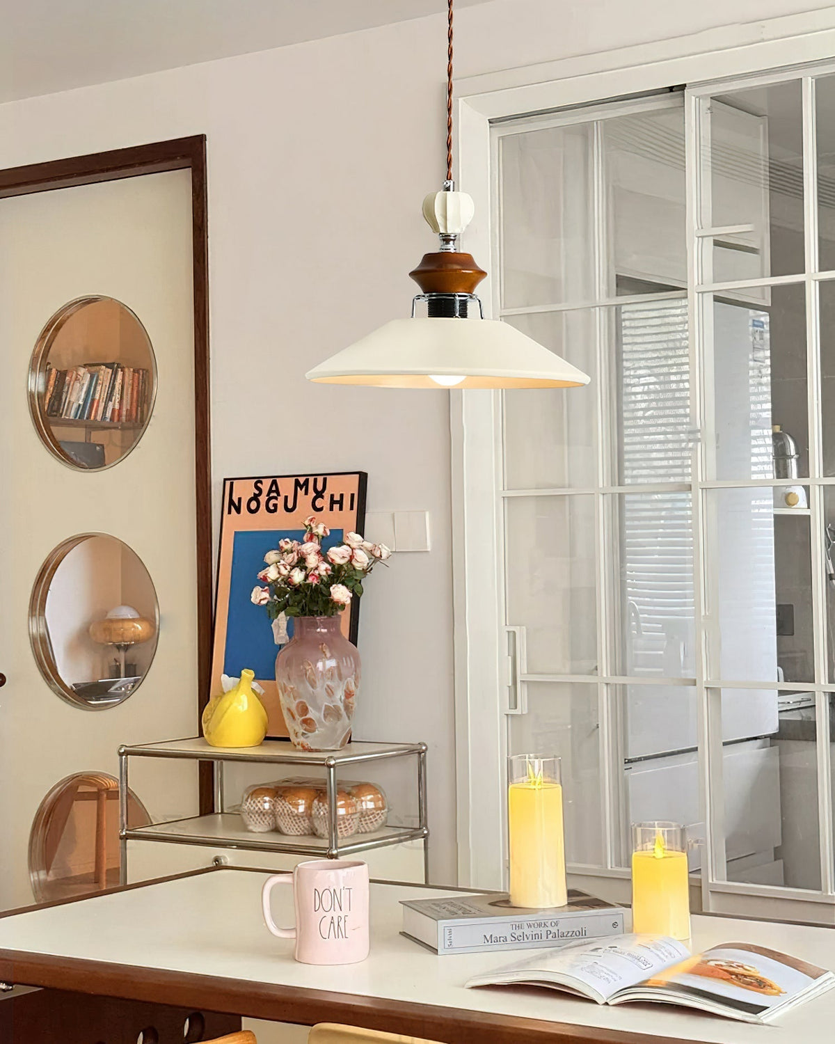 The Adelaide Pendant Light illuminating a dining room table.