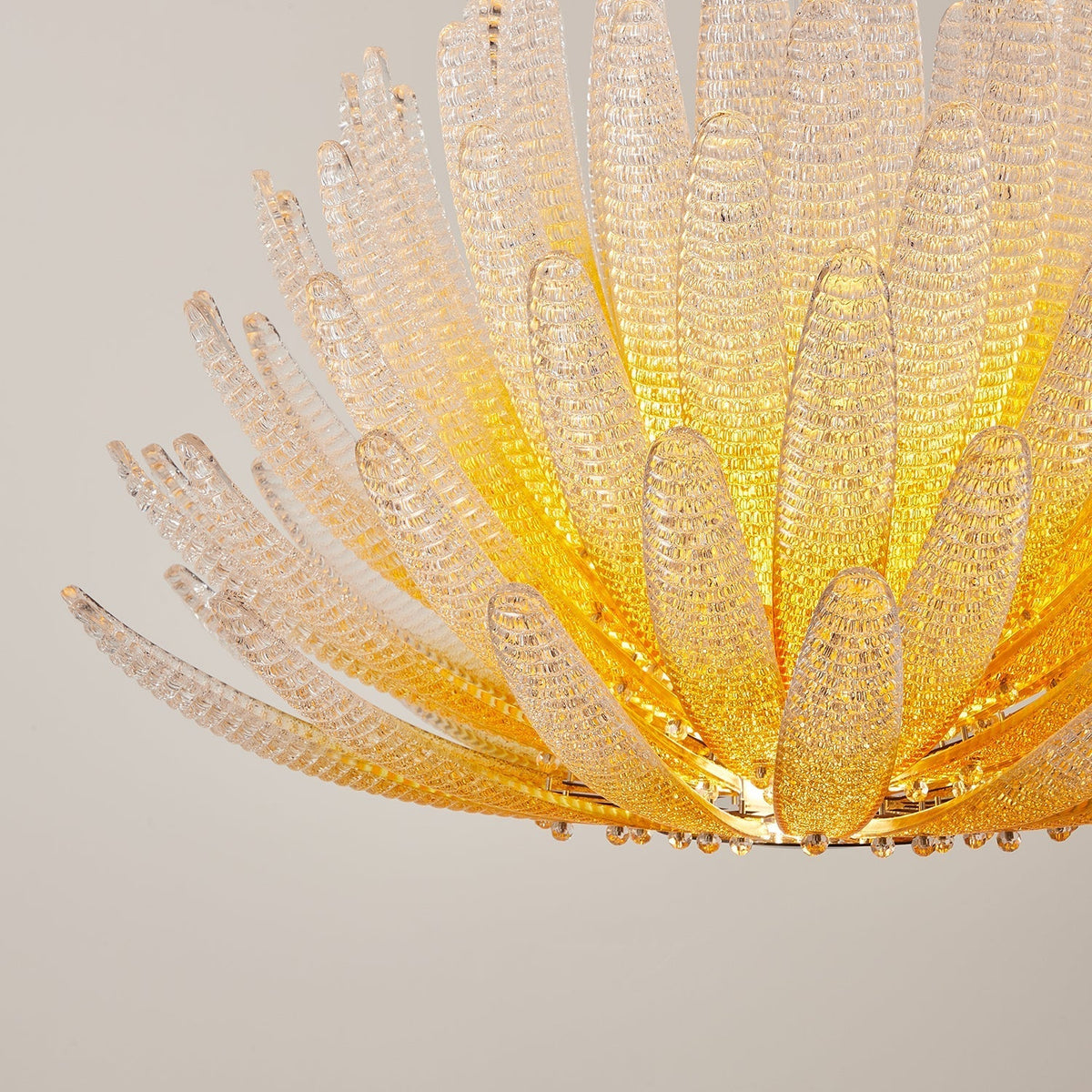 The Agave Chandelier illuminated, casting a warm and inviting glow.