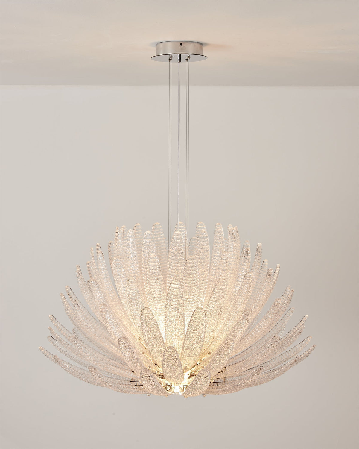 View from below the Agave Starburst Chandelier, showing the radiating glass petals.