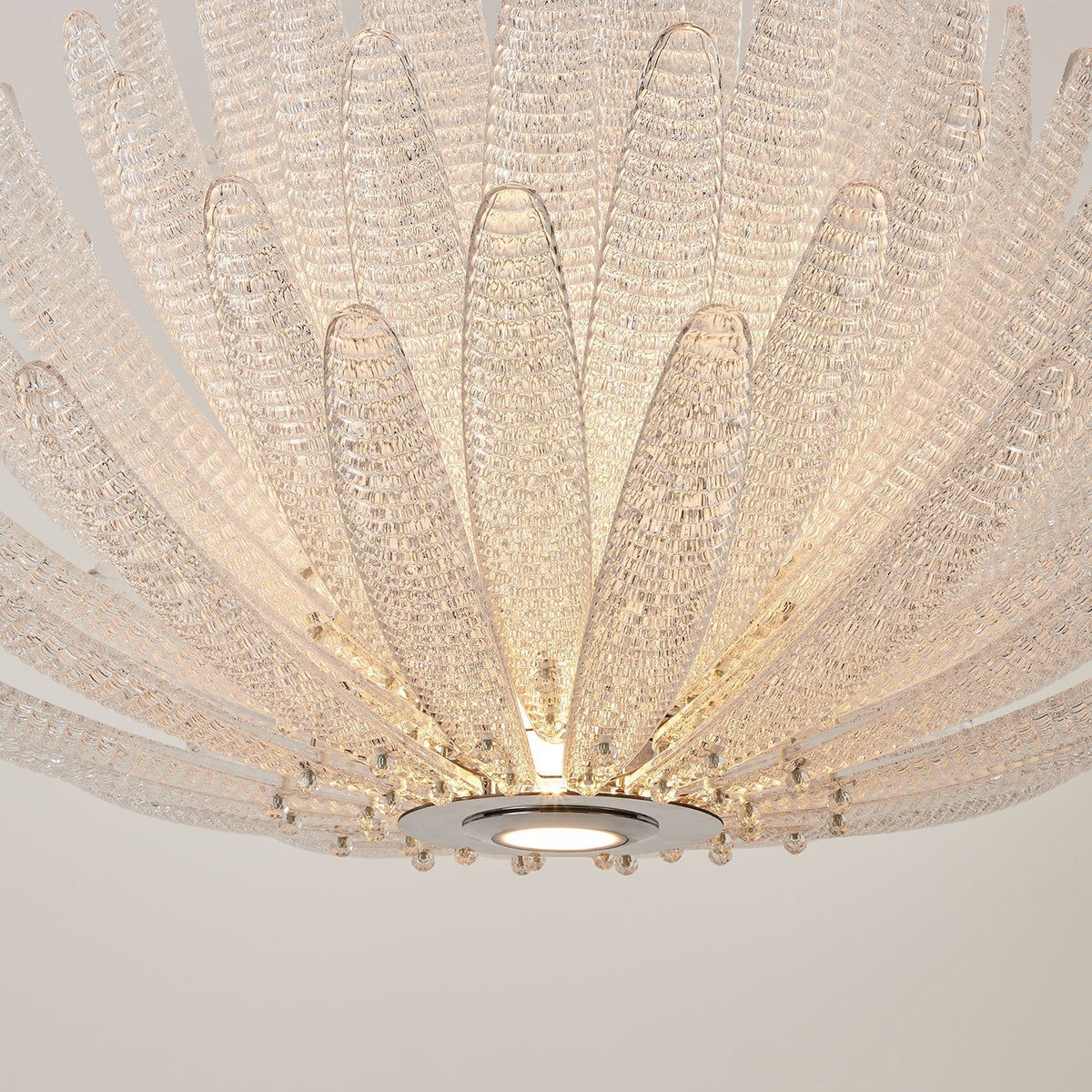 Detailed view of a single purple glass petal from the Agave Chandelier.