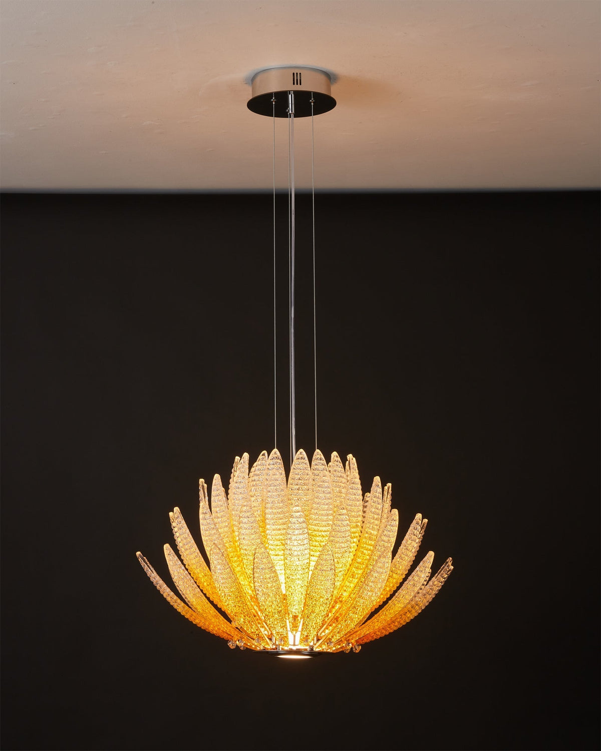 Agave Starburst Chandelier hanging elegantly over a dining table.